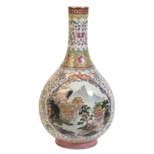 354 - A CHINESE PORCELAIN FAMILLE ROSE BOTTLE VASE

bearing a six character Qianlong mark to the base, 20t... 