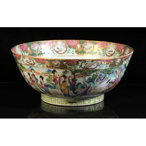 372 - A CHINESE PORCELAIN FAMILLE ROSE PUNCH BOWL

18th/19th century, the interior decorated with panels o... 