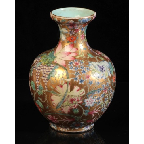 375 - A CHINESE PORCELAIN 'HUNDRED FLOWERS' FAMILLE ROSE VASE

bearing a six character Qianlong seal mark ... 