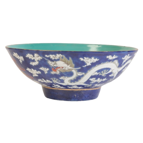 402 - A CHINESE PORCELAIN BLUE GROUND BOWL

bearing a four character mark to the base, probably early 20th... 