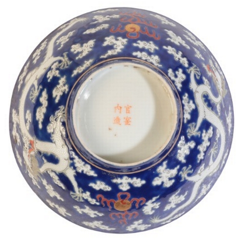 402 - A CHINESE PORCELAIN BLUE GROUND BOWL

bearing a four character mark to the base, probably early 20th... 