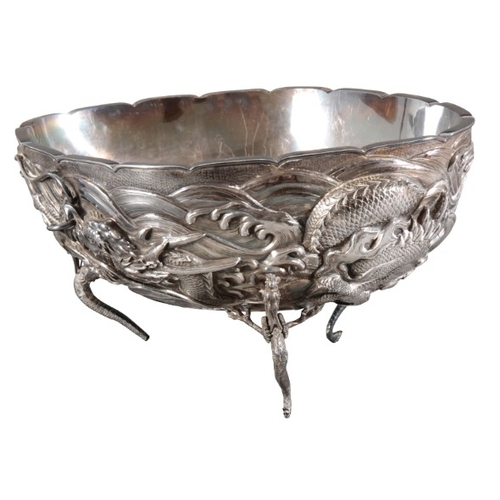 427 - A CHINESE SILVER OVAL PUNCH BOWL

signed to underside, the hollow body relief cast to exterior with ... 