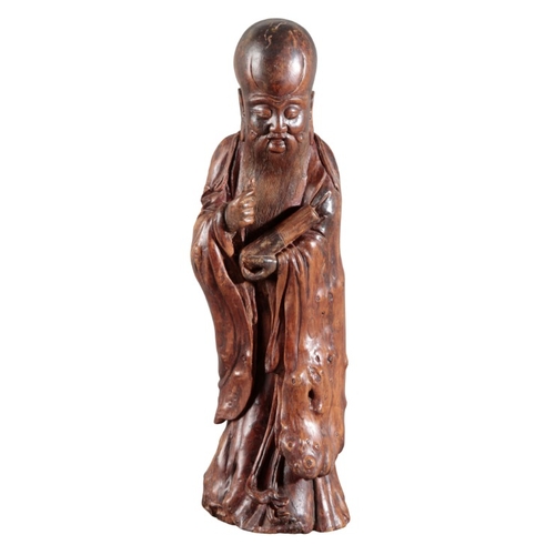 434 - A CHINESE CARVED ROOTWOOD FIGURE OF SHOULAO

possibly Ming dynasty, figured holding a scroll in his ... 