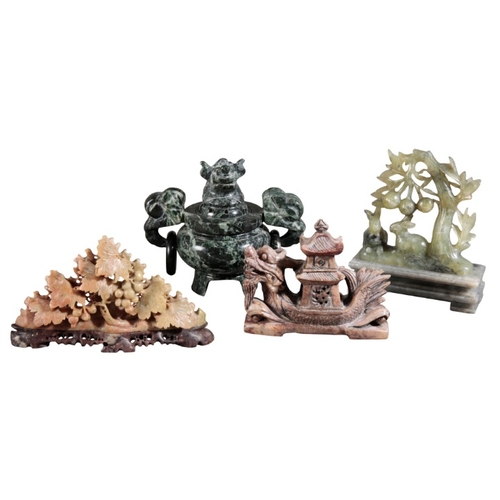 460 - A GROUP OF FOUR CHINESE SOAPSTONE CARVINGS

including a tripod censer, 11cm high, a dragon boat, 8cm... 