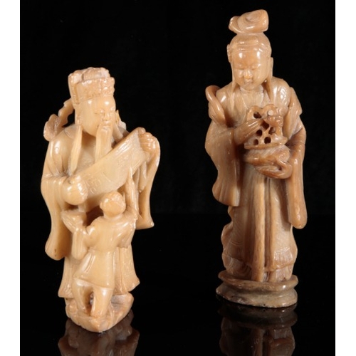 462 - TWO CHINESE SOAPSTONE FIGURES

20th century, including a lady carrying a basket, 20cm high, and a co... 