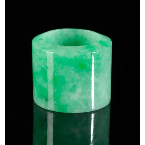 465 - A CHINESE JADE ARCHER'S RING

in pale apple green jadeite, 2.5cm high x 3cm diameter; together with ... 