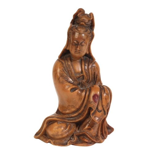 468 - A CHINESE SOAPSTONE FIGURE OF GUANYIN

18th/19th century, figured seating with incised cloud decorat... 