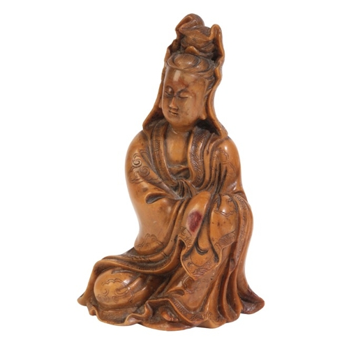 468 - A CHINESE SOAPSTONE FIGURE OF GUANYIN

18th/19th century, figured seating with incised cloud decorat... 