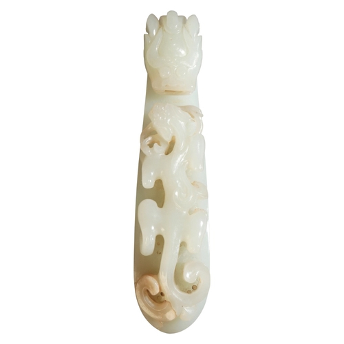 469 - A CHINESE JADE BELT HOOK

Qing dynasty, carved with a chilong beneath a dragons head finial, 13.5cm ... 