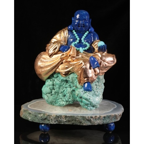 480 - LUIS ALBERTO QUISPE APARICIO (20TH CENTURY) A LAPIS LAZULI FIGURE OF BUDDHA

modelled seated on a tu... 