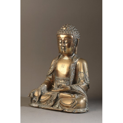 481 - A GILT BRONZE FIGURE OF BUDDHA

Ming dynasty, figured seated in dhyanasana, the right hand extended ... 