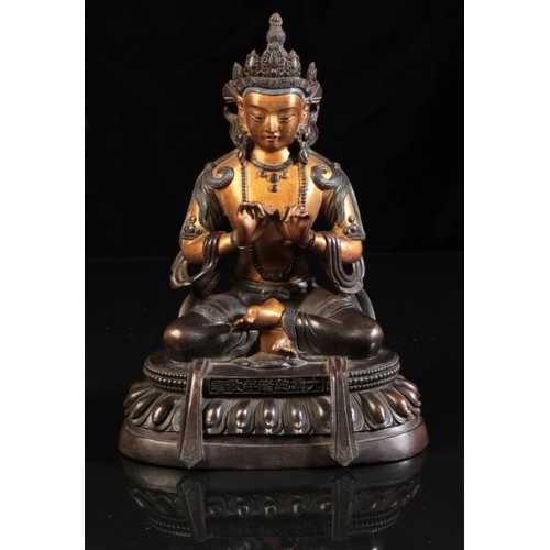 483 - A SINO-TIBETAN PARCEL GILT BRONZE FIGURE OF SEATED BUDDHA

bearing a six character Qianlong mark to ... 