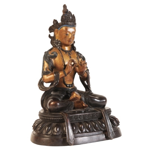 483 - A SINO-TIBETAN PARCEL GILT BRONZE FIGURE OF SEATED BUDDHA

bearing a six character Qianlong mark to ... 