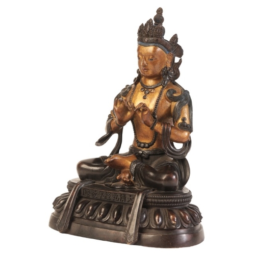 483 - A SINO-TIBETAN PARCEL GILT BRONZE FIGURE OF SEATED BUDDHA

bearing a six character Qianlong mark to ... 