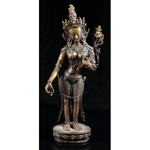 488 - A NEAR PAIR OF NEPALESE BRONZE FIGURES OF TARA

20th century, both cast standing on a single lotus b... 