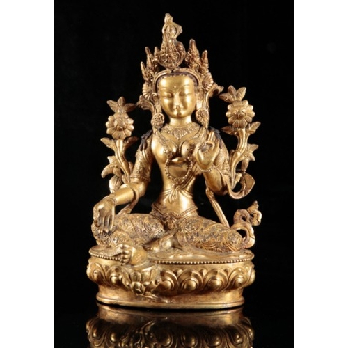 489 - A TIBETAN GILT BRONZE FIGURE OF SEATED TARA

probably 19th or early 20th century, figured on a lotus... 