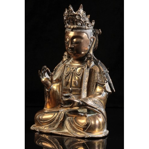 490 - A GILT BRONZE FIGURE OF SEATED GUANYIN

Ming dynasty or later, seated in dhyanasana, the right hand ... 