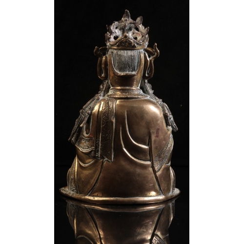 490 - A GILT BRONZE FIGURE OF SEATED GUANYIN

Ming dynasty or later, seated in dhyanasana, the right hand ... 