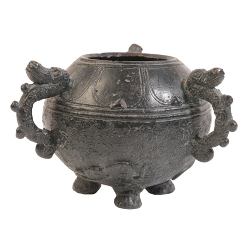 498 - A CHINESE BRONZE TRIPOD CENSER

probably Qing dynasty, with three animals head loop handles, 7.5cm h... 