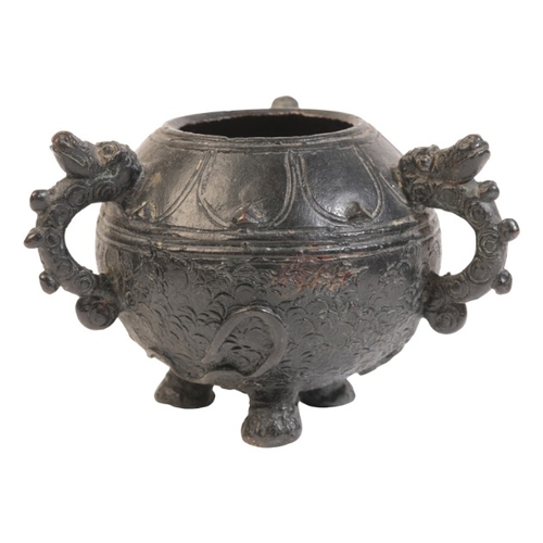 498 - A CHINESE BRONZE TRIPOD CENSER

probably Qing dynasty, with three animals head loop handles, 7.5cm h... 