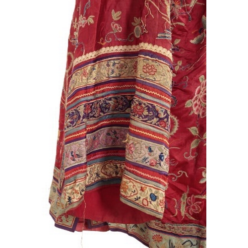 506 - A CHINESE RED SILK ROBE

late Qing dynasty, woven with phoenix in flight, insects and an abundance o... 