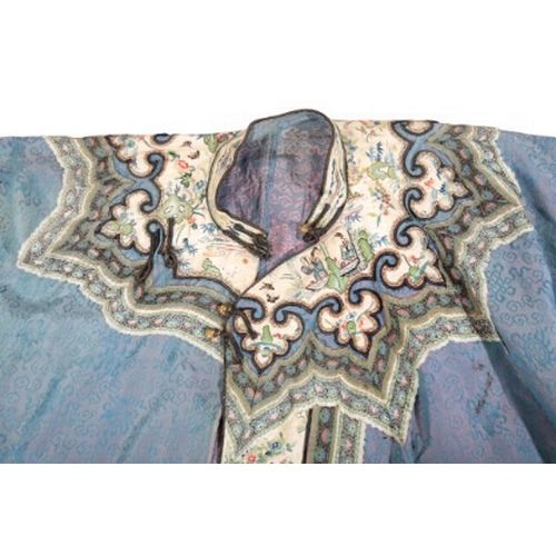 509 - A CHINESE SILK ROBE

Late Qing dynasty, the blue ground woven with auspicious symbols, the contrasti... 