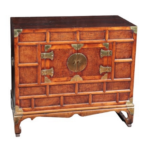 546 - A KOREAN BURR WOOD LOW CABINET

20th century, the cupboard opening to a vacant interior, on shaped b... 