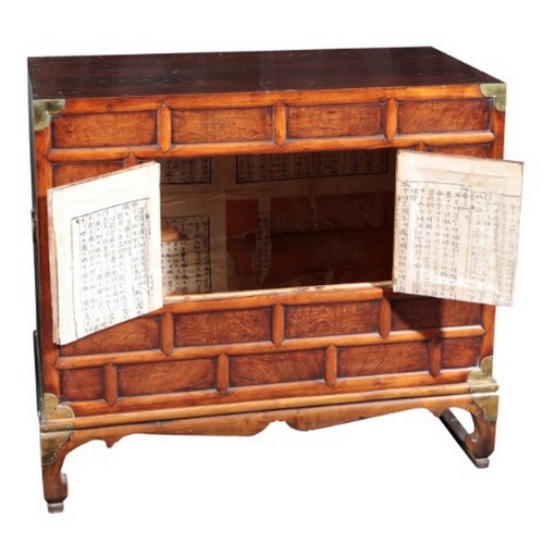 546 - A KOREAN BURR WOOD LOW CABINET

20th century, the cupboard opening to a vacant interior, on shaped b... 