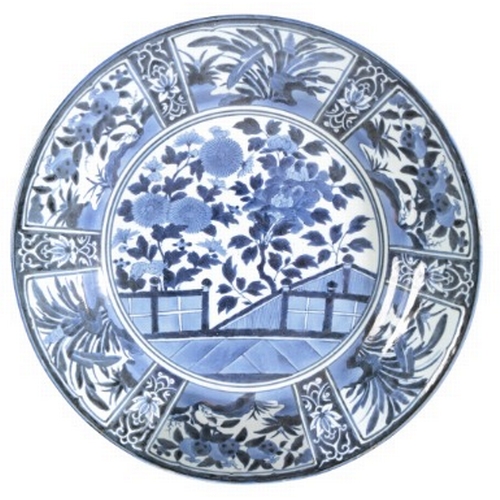 564 - A LARGE JAPANESE BLUE AND WHITE KRAAK CHARGER

Edo period, 17th century, decorated with chrysanthemu... 