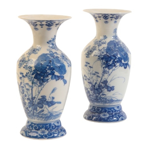 565 - A PAIR OF JAPANESE PORCELAIN BLUE AND WHITE BALUSTER VASES

Meiji period, decorated with birds flyin... 