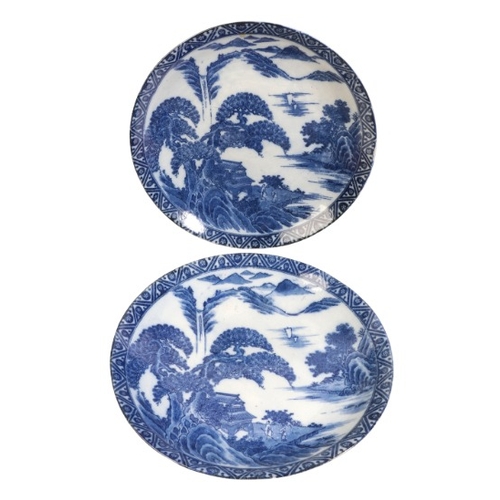 567 - A PAIR OF JAPANESE PORCELAIN BLUE AND WHITE CHARGERS

Meiji Period, each decorated with figures and ... 