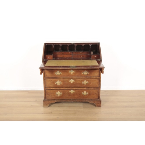 101 - A GEORGE III ELM BUREAU

the fall front enclosing fitted interior, four long graduated drawers under... 