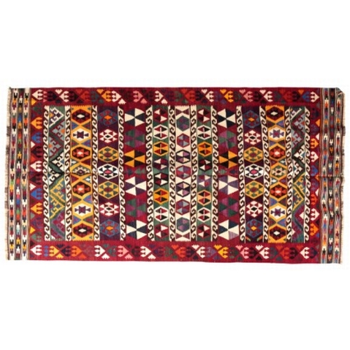 13 - A SOUTH WEST PERSIAN QASHGAI KILIM

woven in colours with lines of geometric motifs and scrolls, on ... 