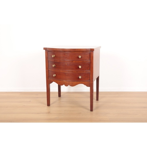 16 - A MAHOGANY SERPENTINE CABINET IN GEORGE III STYLE

three drawers with shaped apron beneath, terminat... 