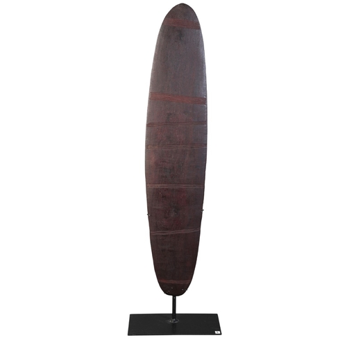 162 - AN ABORIGINAL SHIELD

Australia, 19th/20th century, incised with horizontal linear banding to both s... 