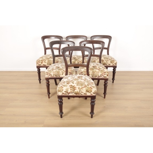 166 - SIX VICTORIAN MAHOGANY BALLOON BACK DINING CHAIRS

upholstered in machined tapestry, of unadorned de... 