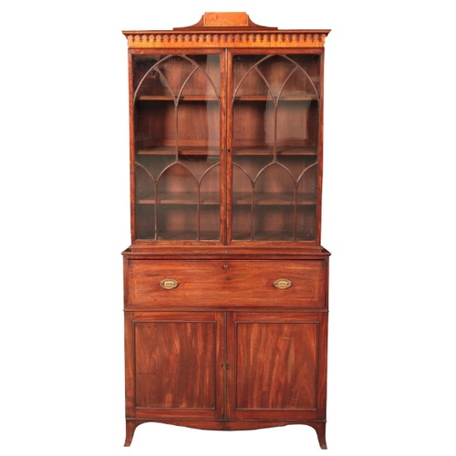 170 - A LATE GEORGE III MAHOGANY SECRETAIRE BOOKCASE

the upper section with a moulded and satinwood bande... 