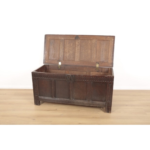 20 - AN ENGLISH OAK COFFER

17th century, the hinged lid opening to a vacant interior, the panelled front... 