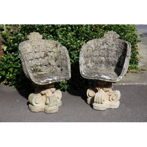 228 - A PAIR OF RECONSTITUTED STONE GARDEN 'GROTTO' CHAIRS

with high scalloped backs and arms, terminatin... 