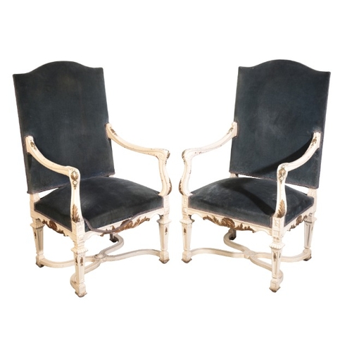 313 - A PAIR OF CONTINENTAL WHITE PAINTED AND PARCEL GILT ARMCHAIRS

20th century, with blue velvet covers... 