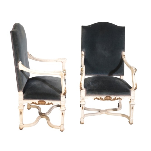 313 - A PAIR OF CONTINENTAL WHITE PAINTED AND PARCEL GILT ARMCHAIRS

20th century, with blue velvet covers... 