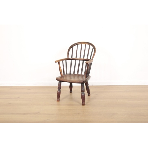 316 - A CHILD'S ELM AND ASH WINDSOR CHAIR

19th century, with bow -shaped back, highly figured seat and tu... 