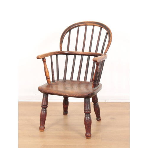 316 - A CHILD'S ELM AND ASH WINDSOR CHAIR

19th century, with bow -shaped back, highly figured seat and tu... 