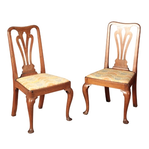 324 - A PAIR OF GEORGE I WALNUT SIDE CHAIRS

the pierced vase shape backs splats over drop-in seats with '... 