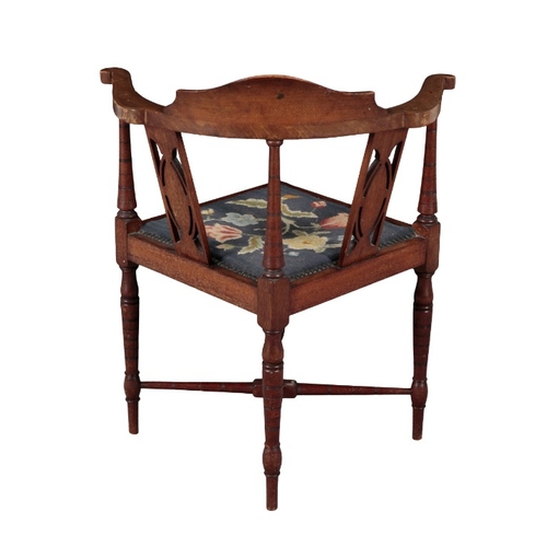 36 - AN EDWARDIAN MAHOGANY CORNER ARMCHAIR

inlaid with paterae to the cresting rail and back splats, wit... 