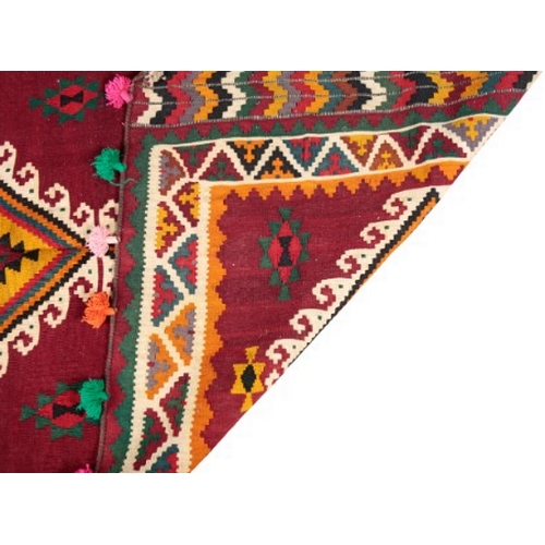 40 - A SOUTH WEST PERSIAN QASHGAI KILIM

woven in colours with three hooked lozenge medallions, on a crim... 