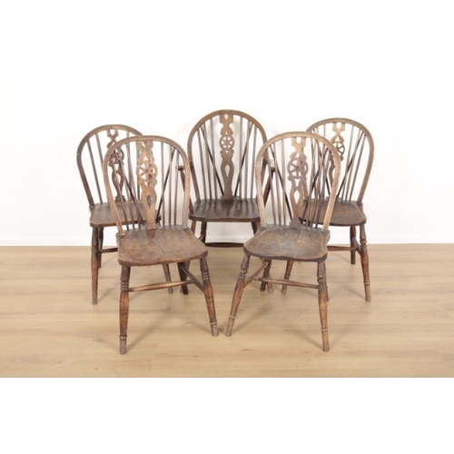 5 - FIVE MATCHED BEECH AND ELM WINDSOR WHEELBACK CHAIRS

19th century and later, including a carver armc... 