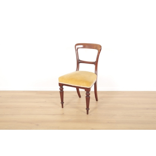 53 - FIVE VICTORIAN MAHOGANY BALLOON BACK DINING CHAIRS

upholstered in yellow velvet, with carved scroll... 