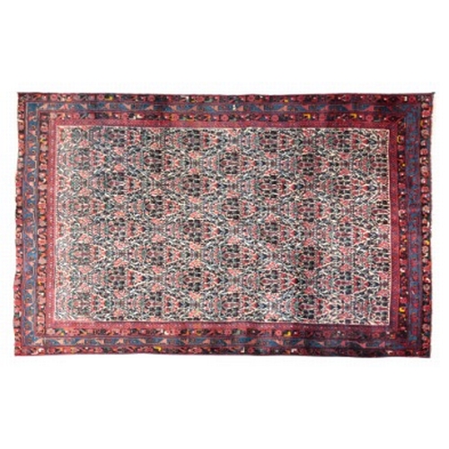 58 - A NORTH WEST PERSIAN AFSHAR RUG

woven in colours with dense floral repeat on an off white ground, w... 