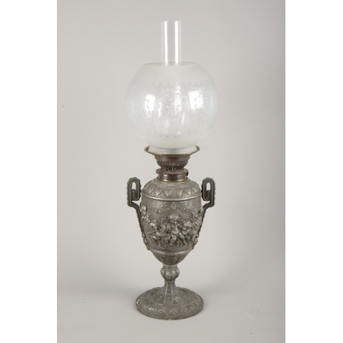 59 - A VICTORIAN PEWTER OIL LAMP IN ROCOCO STYLE BY THE 'CANDLE COMPANY... NEW BOND STREET'

decorated wi... 